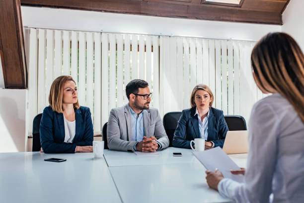 istock Team of managers conducting job interview. 1165399820