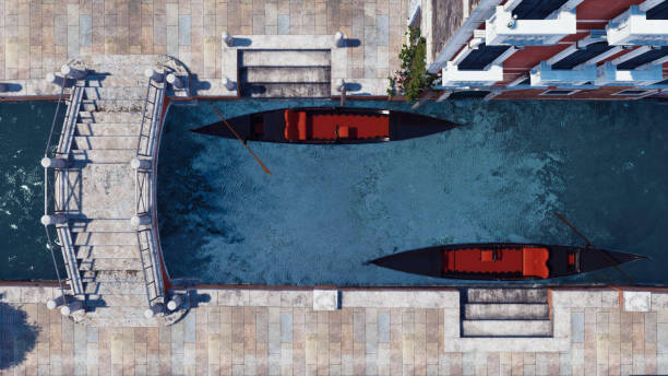 Top down view of moored empty venetian gondolas and old stone bridge on a narrow water canal in Venice, Italy. With no people realistic 3D illustration from my own 3D rendering file.