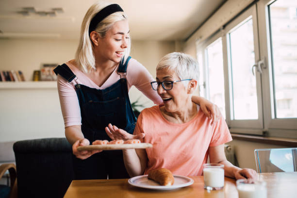 istock Girl serving breakfast for her mom 1165400802