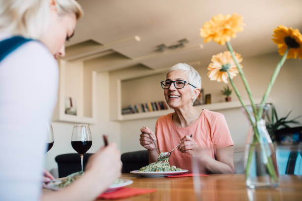 istock Mother and daughter having lunch 1165400966