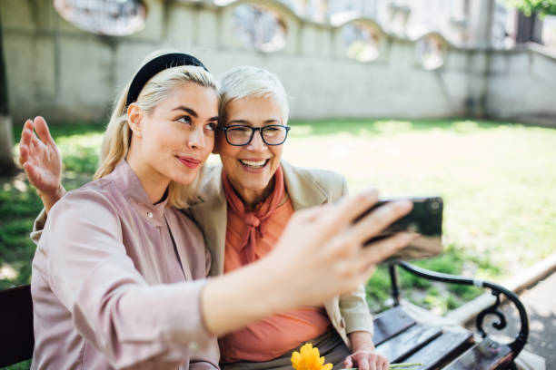 istock Mother and daughter taking a selfie 1165401847