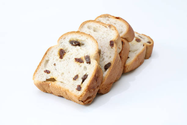 Pictured sliced raisin bread in a white background.