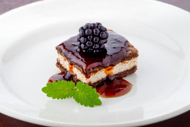 Blackberry tiramisu, layered cake with cookies, cream and blackberry