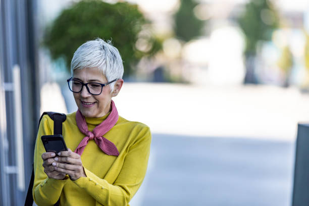 istock Businesswoman reading text message on smart phone 1165411547