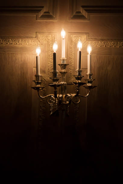 istock old lantern lit up in a dark room 1165415416
