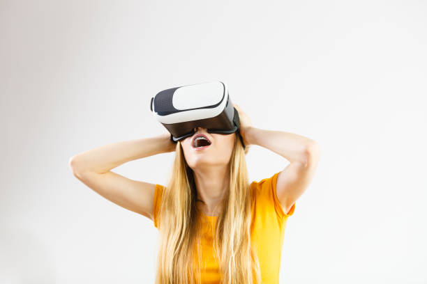 istock Girl wearing virtual reality goggles. 1165417799