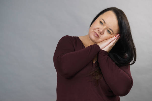 istock Woman being sleepy gesturing 1165417849