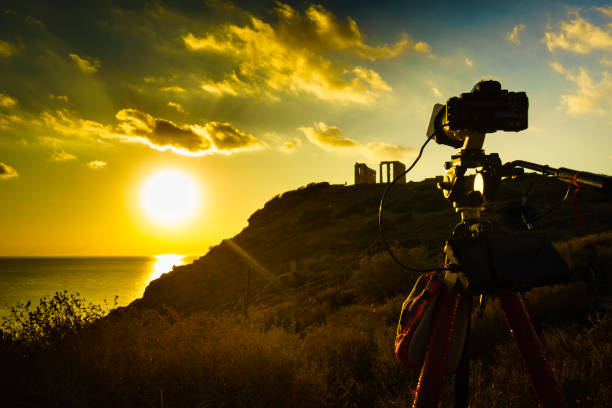 istock Camera and greek temple of Poseidon, Cape Sounio 1165417879