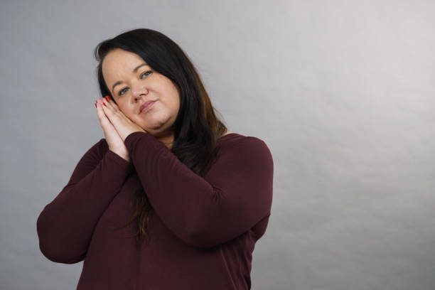 istock Woman being sleepy gesturing 1165418009