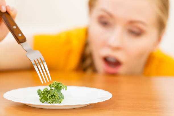 istock Shocked young woman being on diet 1165418731