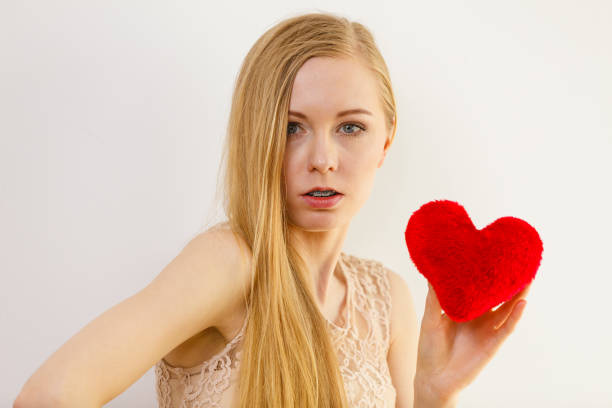 istock Sad woman on Valentines day 1165418848