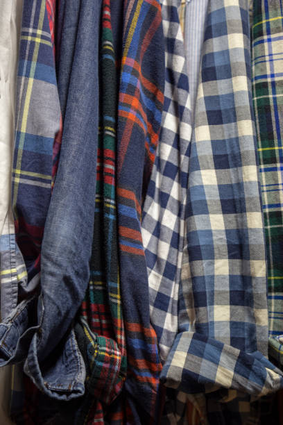 istock Assorted Men's Shirts Hanging in a Closet 1165422042