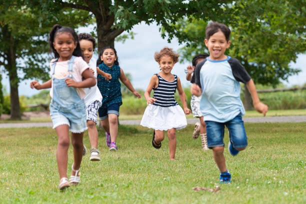istock Cute Kids Running Outside in the Schoolyard 1165422405