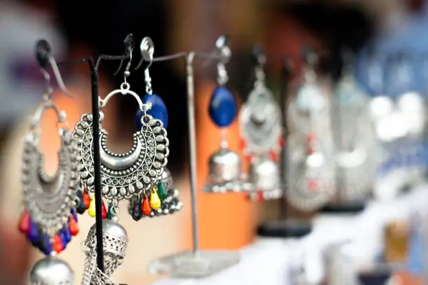 Traditional handmade jewellery in jaipur shot against a blurred background. These artificial semiprecious items are perfect accessories for ladies for events like weddings, occassions and are a booming business