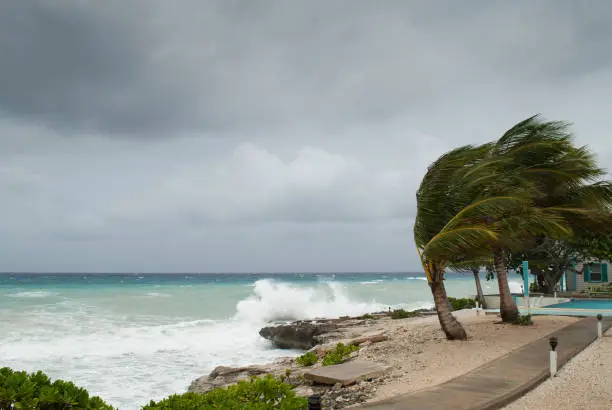 the Caribbean coastline of Grand Cayman gets battered in a hurricane.