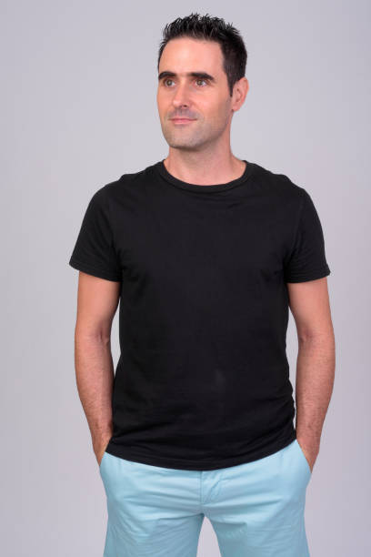 istock Portrait of handsome man against white background 1165426410