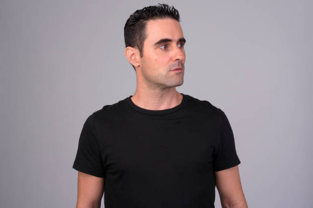 istock Portrait of handsome man against white background 1165426431