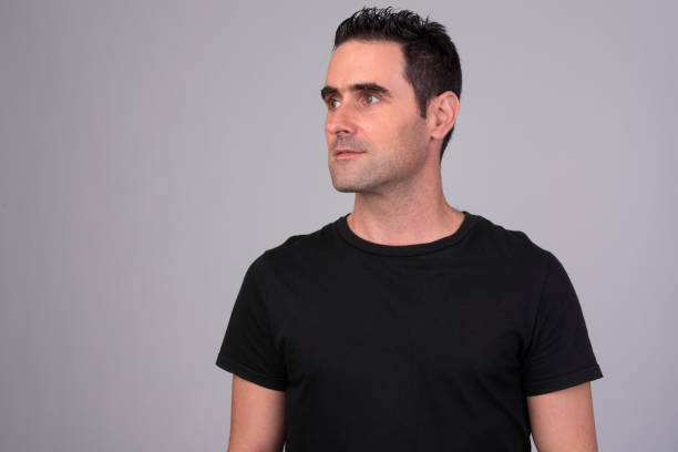 istock Portrait of handsome man against white background 1165426432