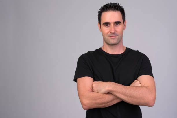 istock Portrait of handsome man against white background 1165426438