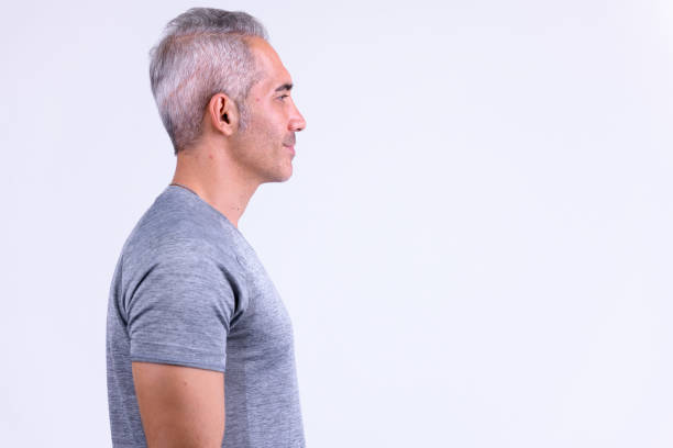 Studio shot of handsome Persian man against white background