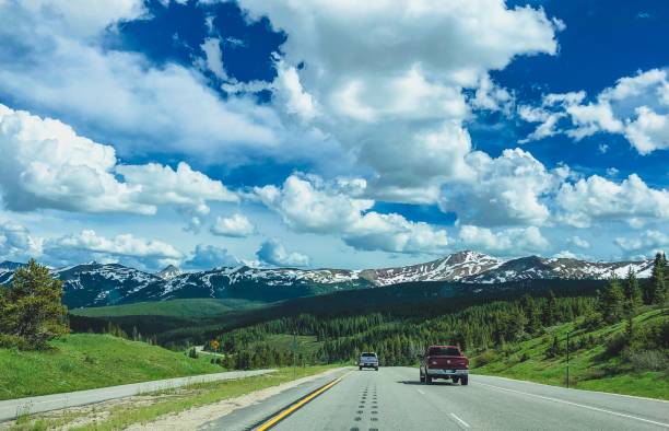 istock cars driving through the rocky mountains 1165427461