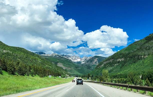 istock cars driving toward mountains 1165427557