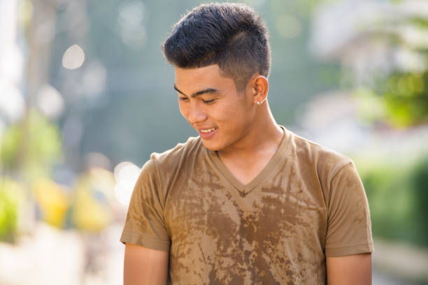 Portrait of young Asian man in the streets outdoors