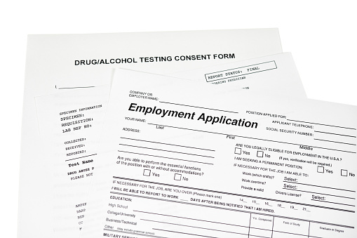 Employment application with a drug, alcohol test consent form isolated on white