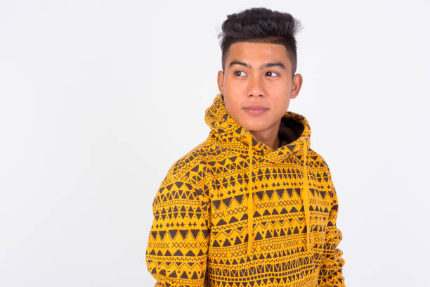 istock Young Asian man with hoodie thinking and looking up 1165428444