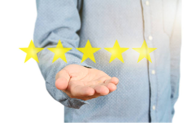 istock Hand touching five star symbol to increase rating 1165430584