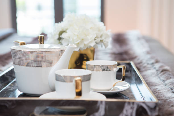 istock Luxury White Tea Set in Tray on Bed in the bedroom 1165431154