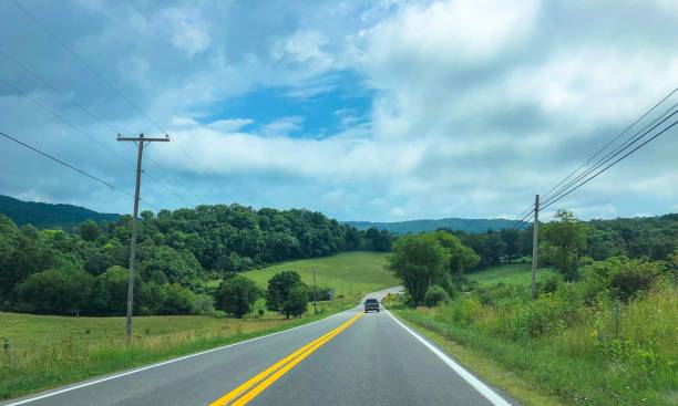 istock car driving through the hills in west virginia 1165433238
