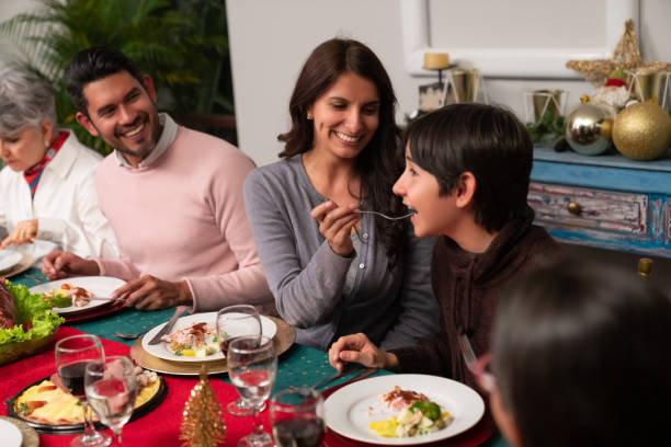 istock Happy family having dinner at Christmas Eve 1165436126