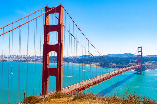 The iconic picture perfect Golden Gate Bridge on a sunny summer day. Captured from Battery Spencer near Sausalito city in Marin County, opposite San Francisco city Bay Area in California United States