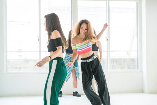 istock Young female dancers dance in studio 1165438546
