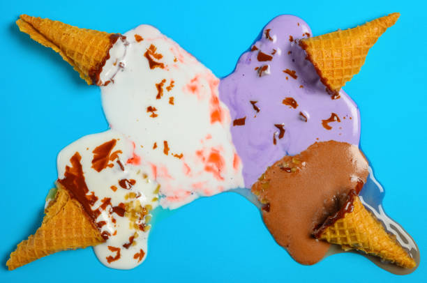 istock top view mini ice cream cones melted completely on a blue background 1165440169
