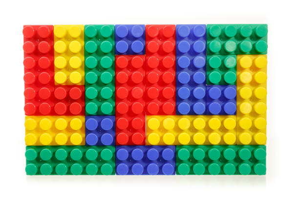 istock Children's colorful plastic construction toy bricks on white 1165444301