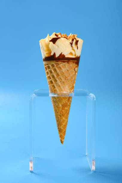 istock side view mango and chocolate flavor ice cream cone with peanut on blue background 1165447826