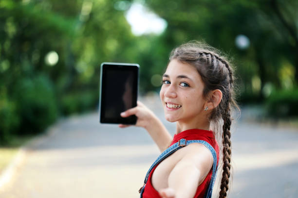 istock Young girl taking selfies 1165449436