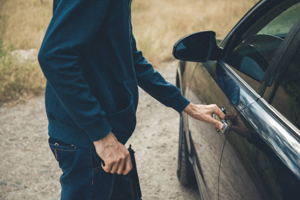 istock angry man hand gun with car door 1165452749