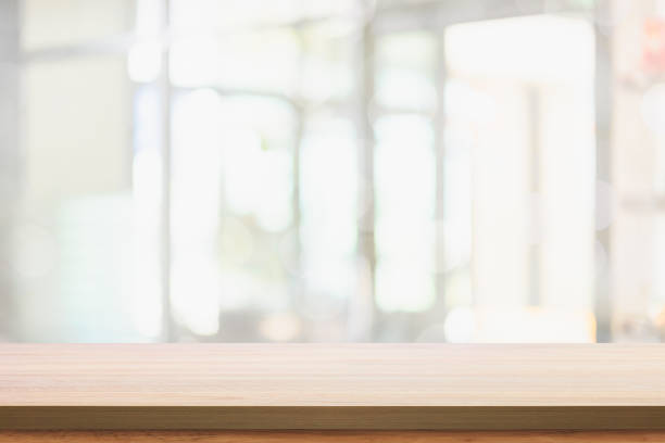 istock Empty wooden table with blur living room interior background. 1165452893