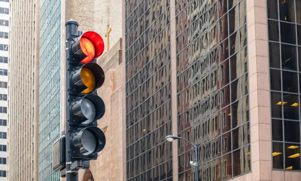 Photo of Red traffic lights for cars, office buildings background, Chicago city, Illinois