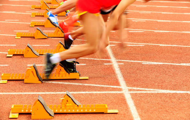 istock sprint start in track and field in blurred motion 1165456587