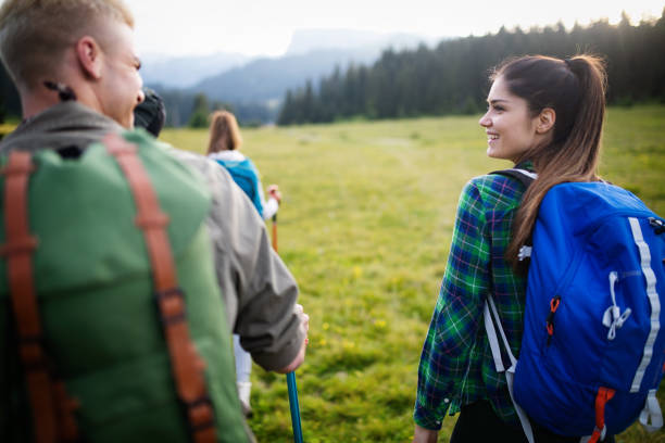 istock Group of hikers walking on a mountain and smiling 1165457563