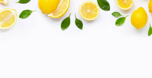 istock Fresh lemon and  slices  with leaves isolated on white. 1165457586
