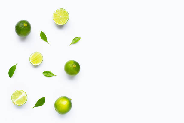 istock Limes with leaves isolated on white background. 1165457589