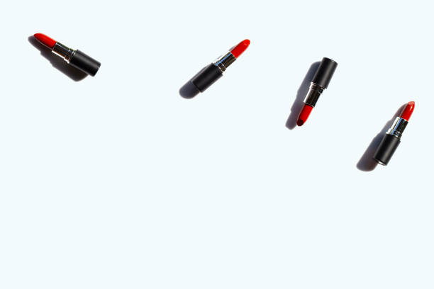 istock Flat lay composition, Lipsticks on white background with shadow. Beautiful Make-up concept 1165457662
