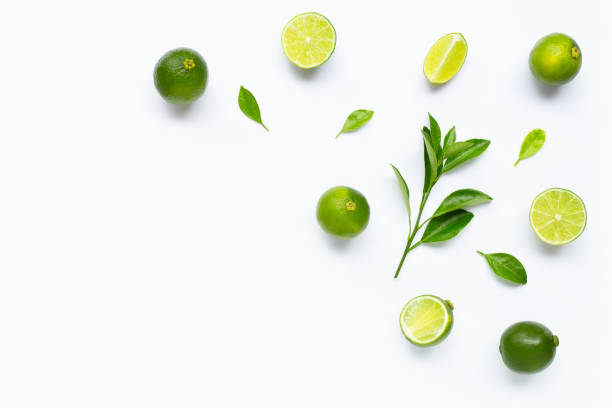 istock Limes with leaves isolated on white background. 1165457665