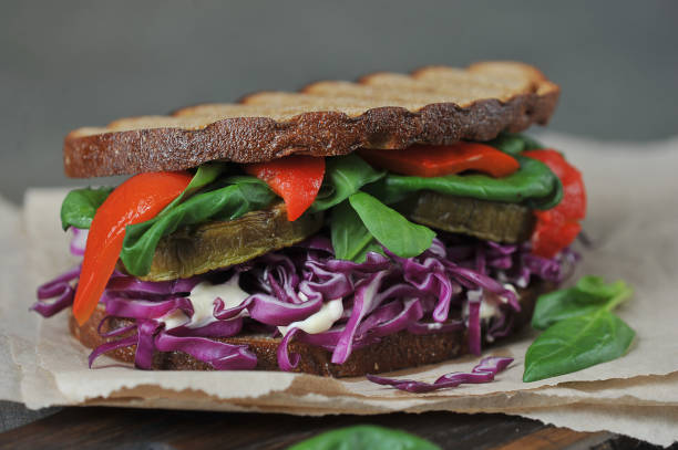 istock Veggie sandwich with red cabbage, spinach and grilled vegetables. 1165460438