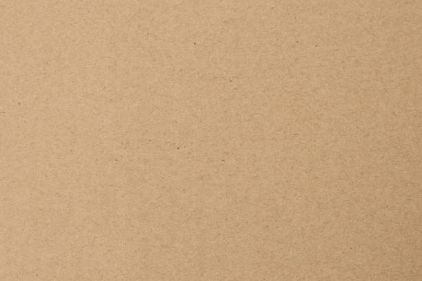 istock Yellow wrapping background. Brown paper texture. Beige parchment, manuscript. Natural sheet surface. 1165462983